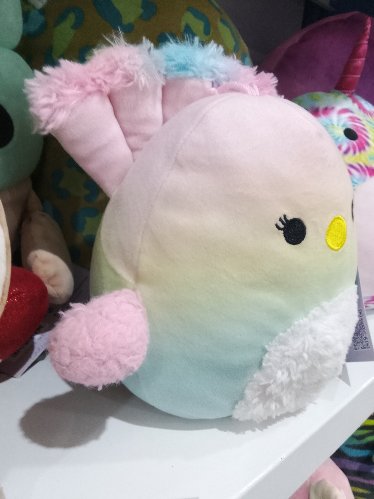 Squishmallows Briannika the Peacock plush toy, pastel ombre design and fluffy wings.