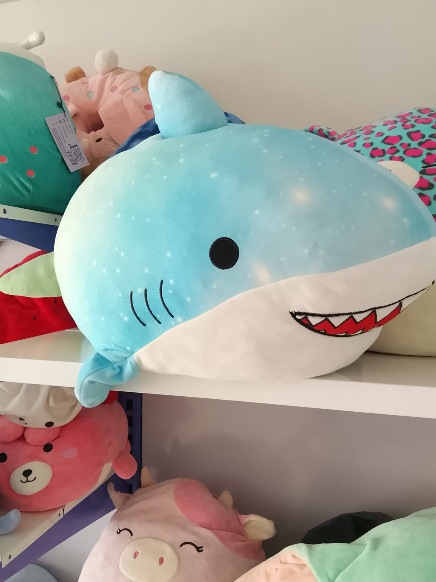 Squishmallows plush toy featuring the character Santos the Shark.
