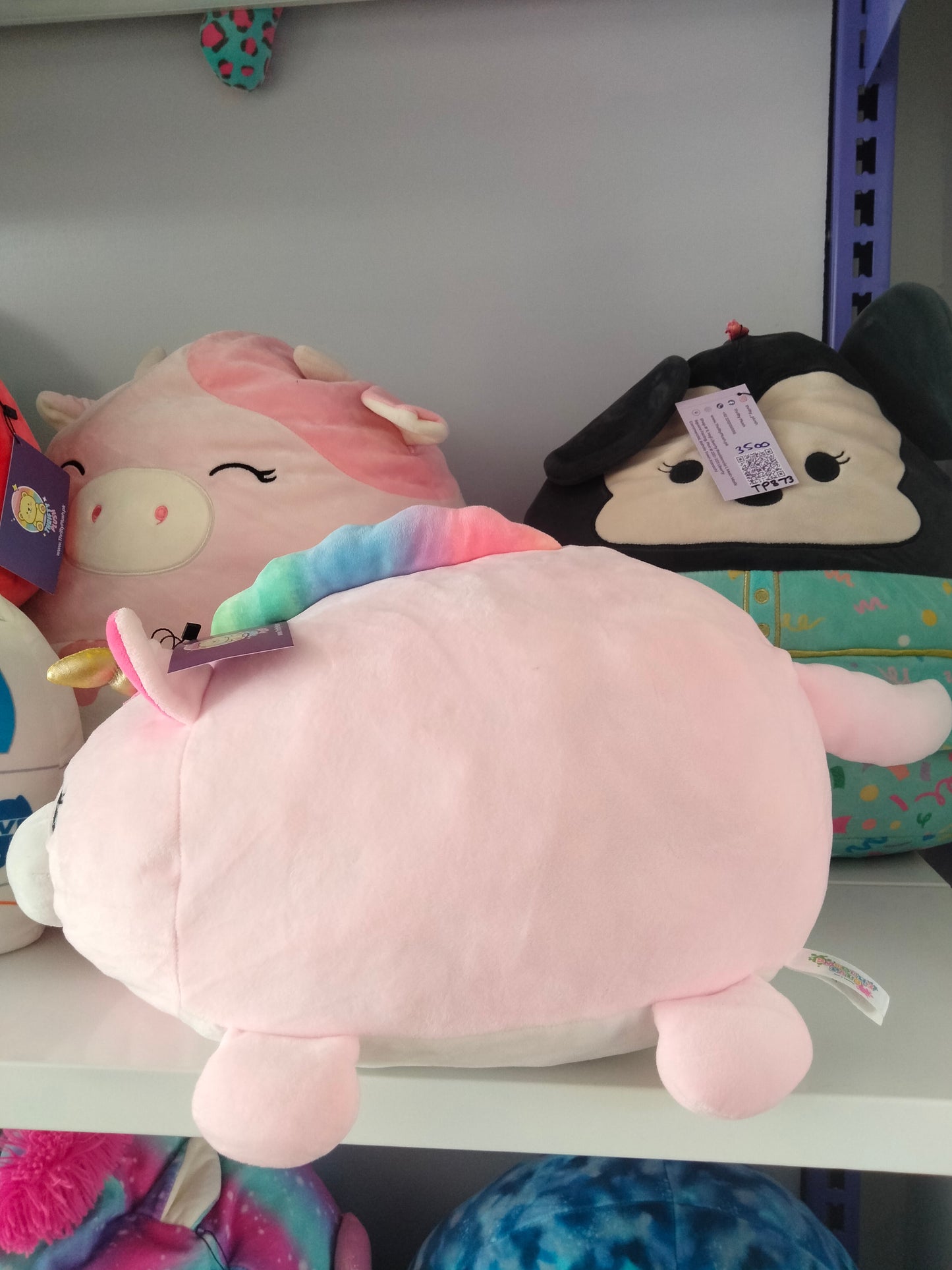 Large pink unicorn plush toy