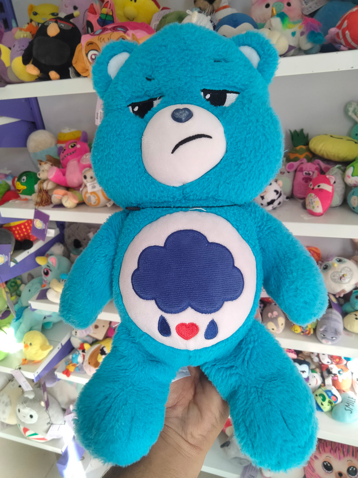 Care Bears Grumpy Bear plush toy.