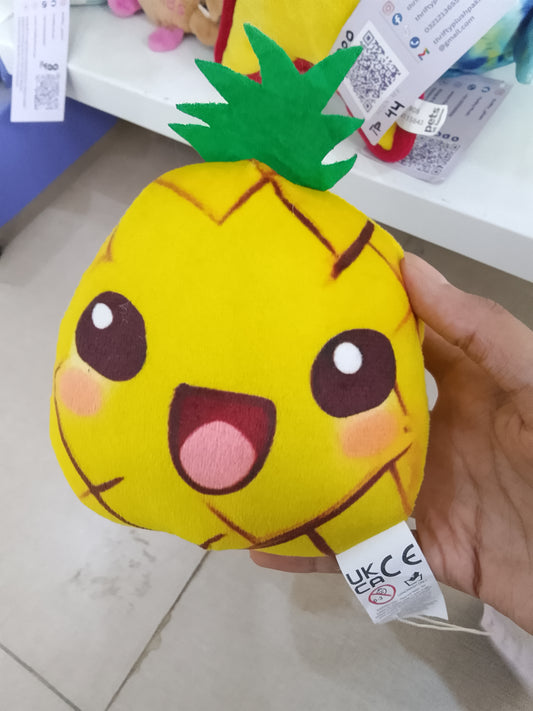 yellow plush Smooshos Pals pineapple toy with a happy face.
