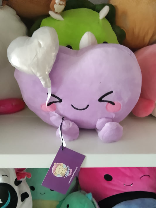 Purple heart holding a white balloon plush toy.