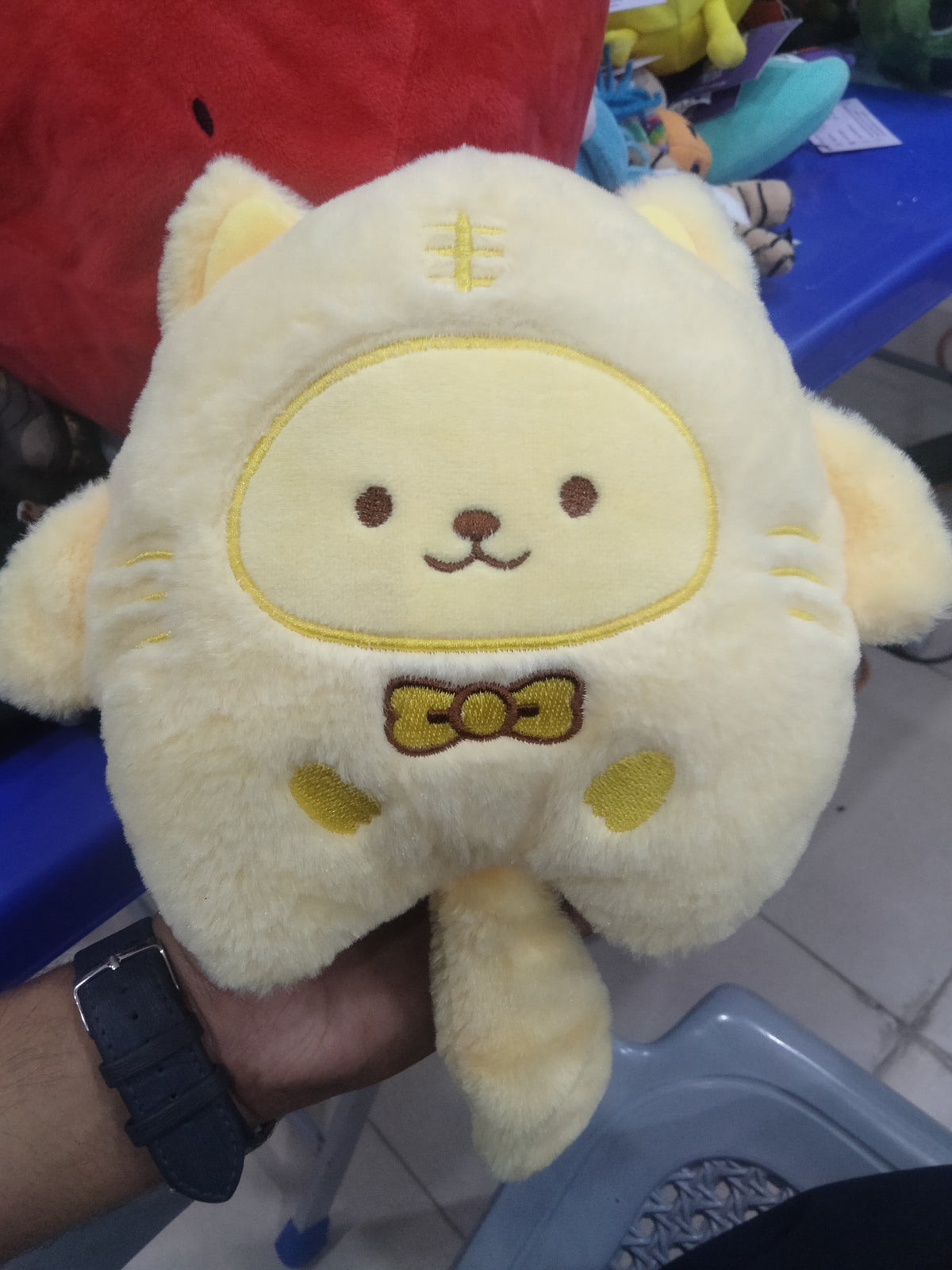 yellow Pompompurin Sanrio plush.