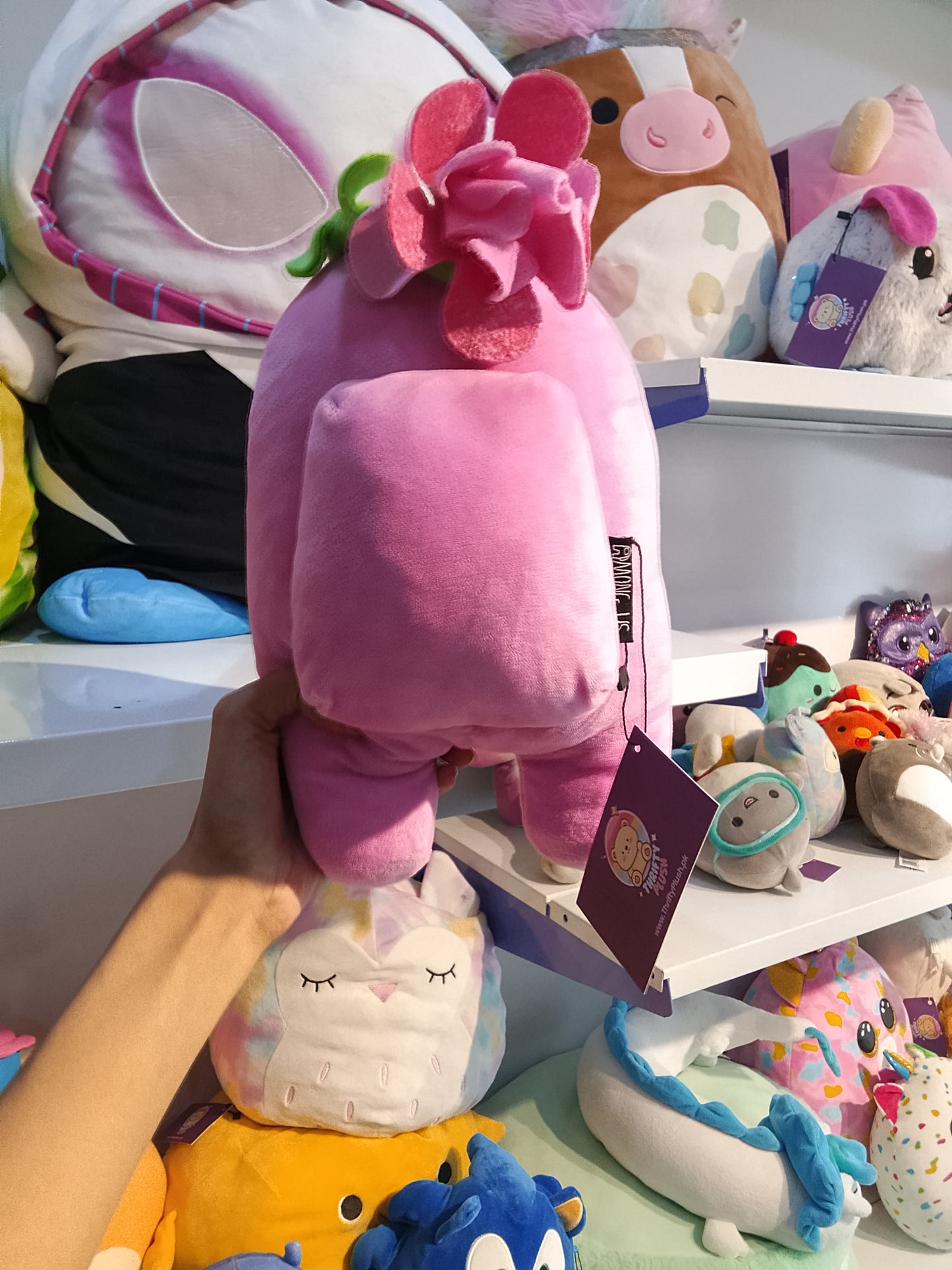 Pink Among Us plush toy.