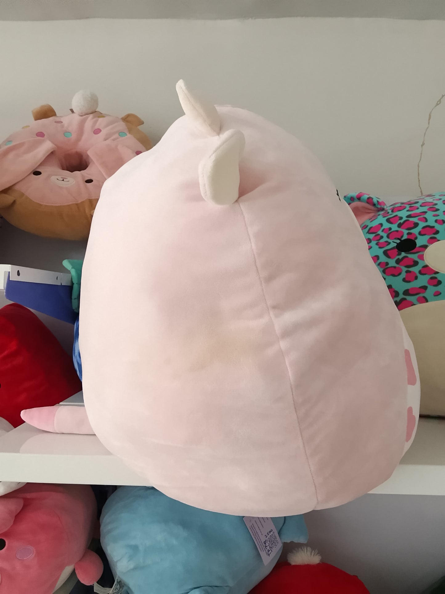 Squishmallows Clay the Pink Cow plush toy.