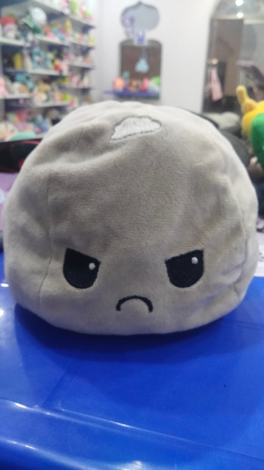 This is a reversible octopus plushie with an angry face on the grey side