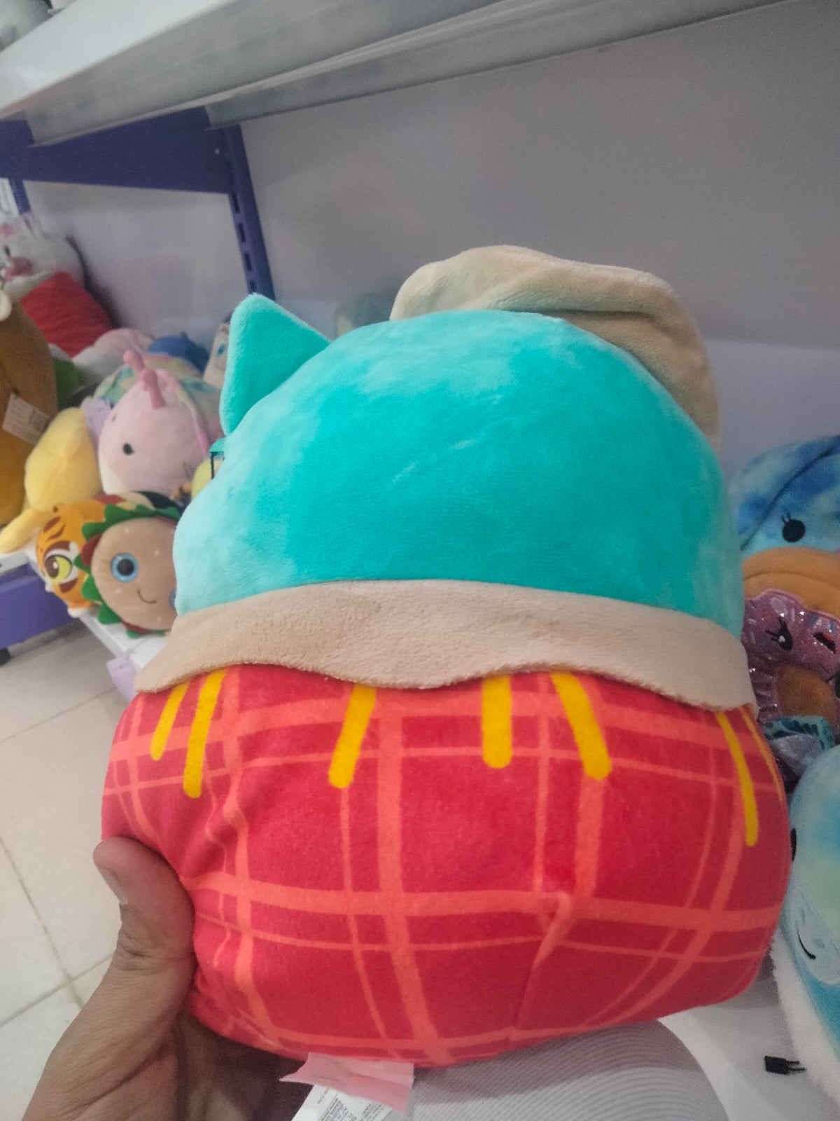 This is a Squishmallows Winston the Scarecrow Owl plush toy.