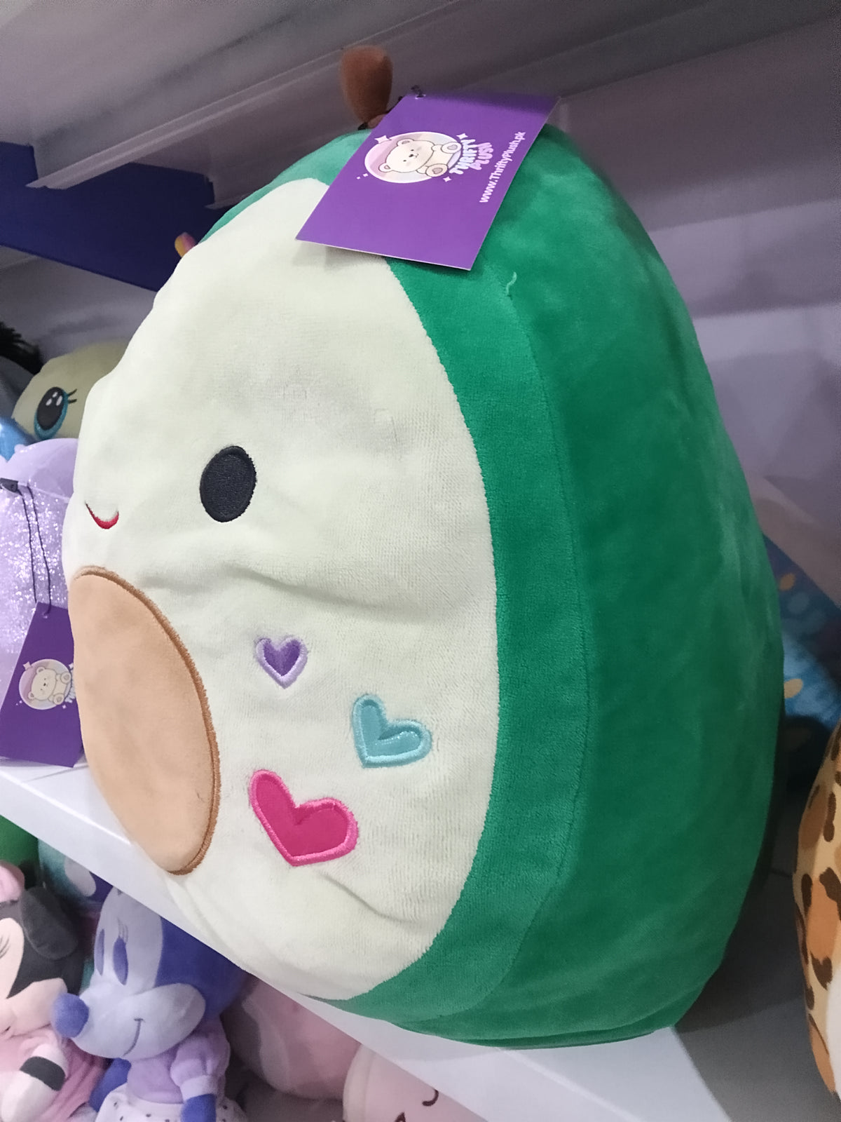 Squishmallows Austin the Avocado plush toy.