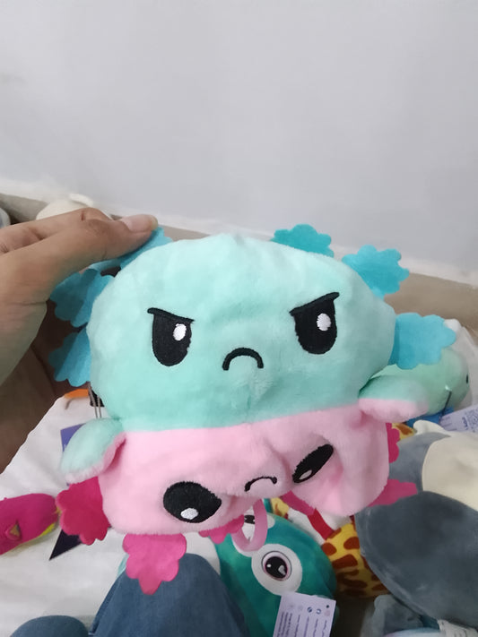 TeeTurtle Reversible Axolotl Plushie in aqua and pink colors.