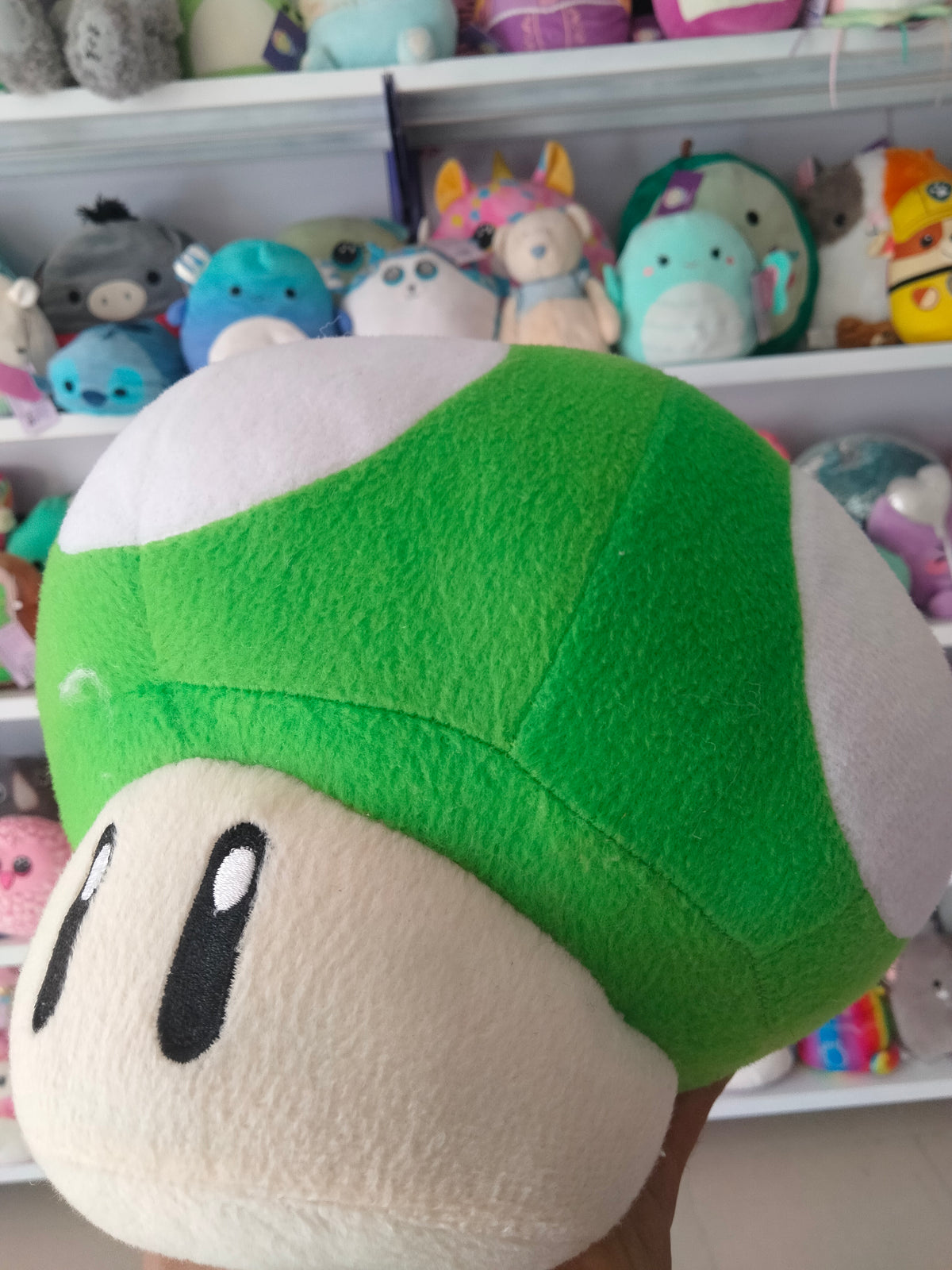 Super Mario All Star Collection 1-Up Mushroom plush doll.