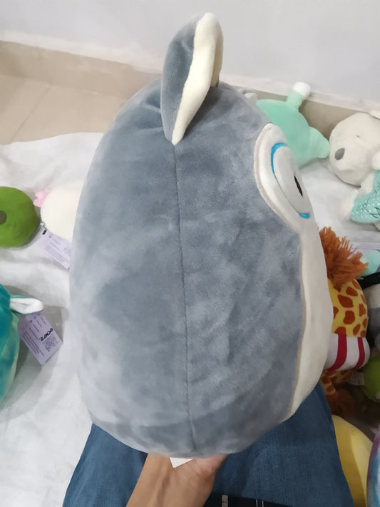 Squishmallows Ryan the Husky plush toy featuring blue glasses.