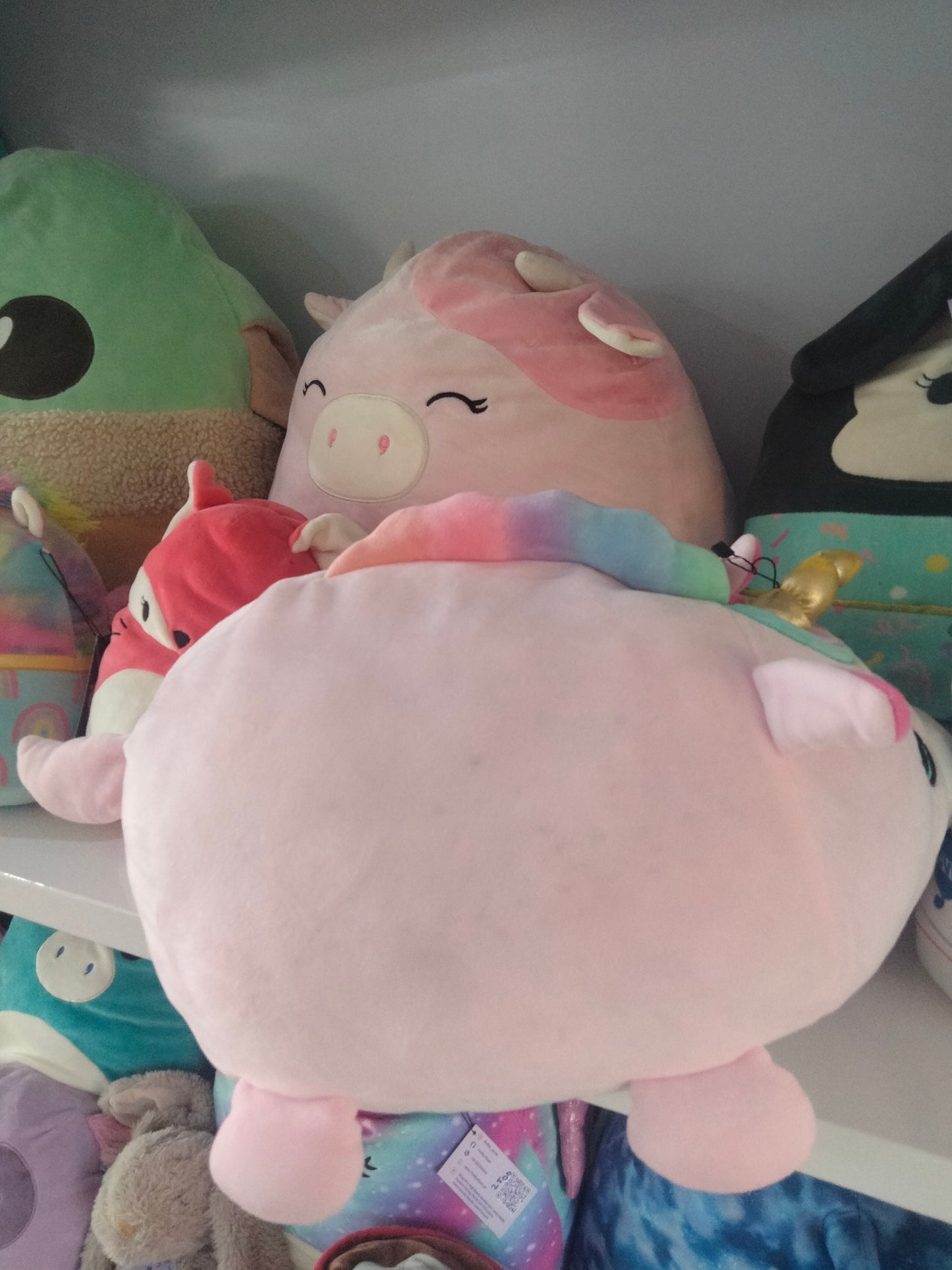 Large pink unicorn plush toy