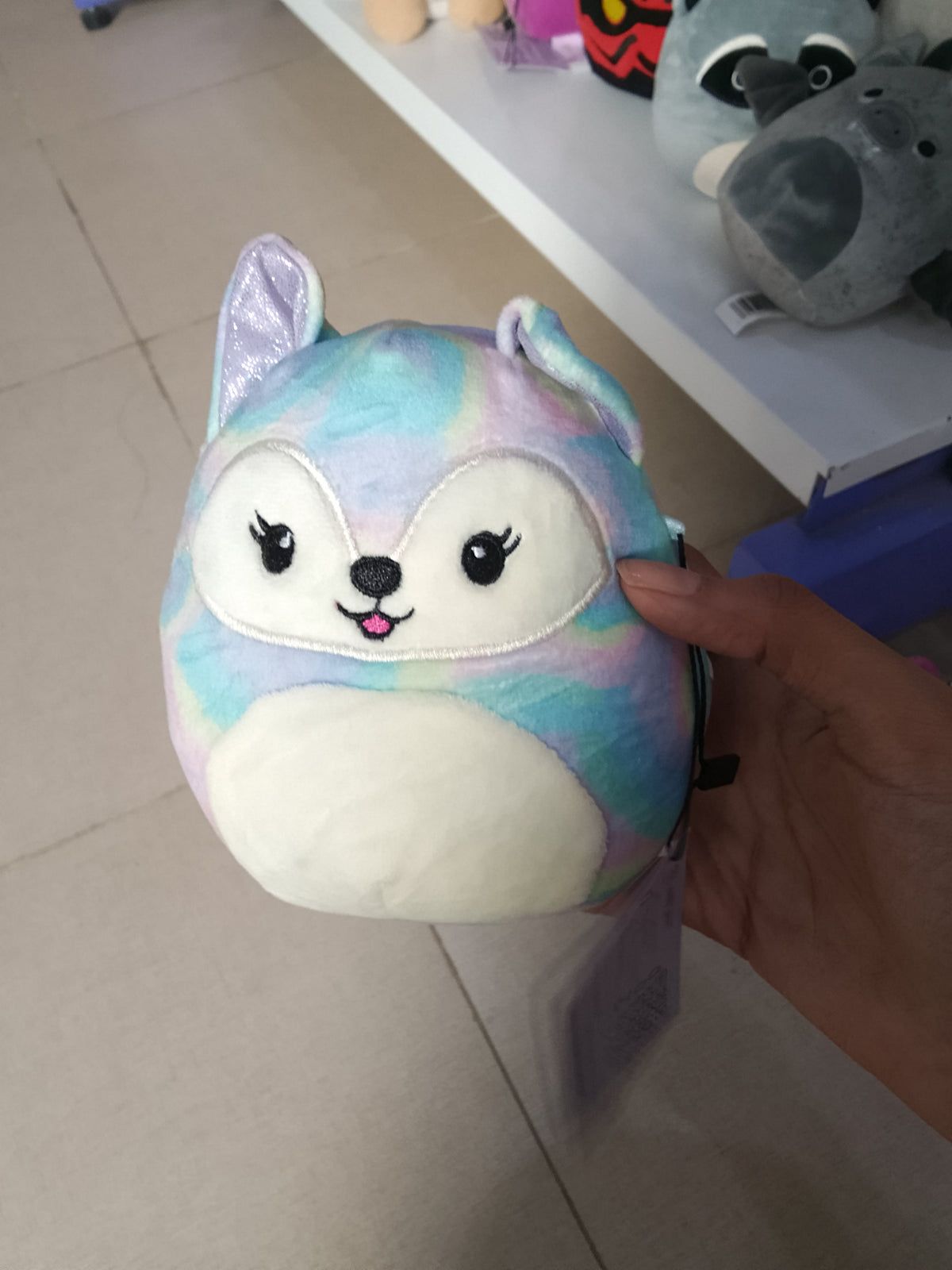 Squishmallows Felexine the Rainbow Fox plush toy.