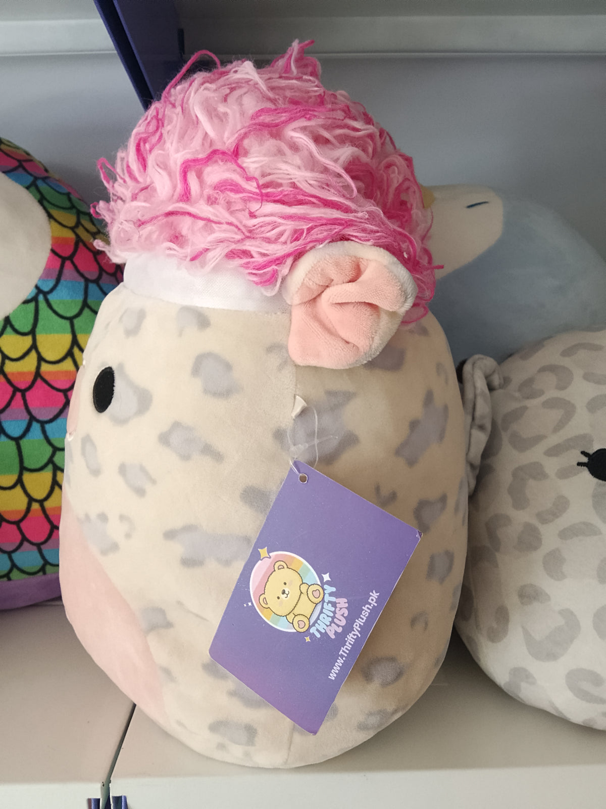 Squishmallows Squish-doos Rosie the Pig plush toy featuring a pink furry hairstyle.
