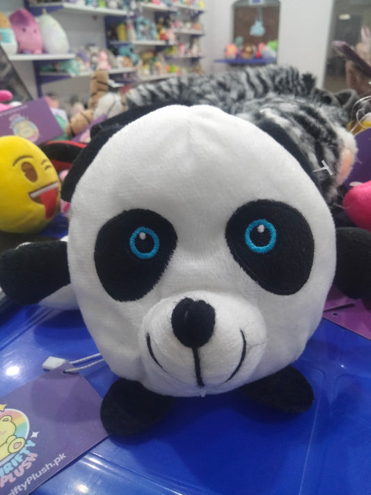 small round plush panda toy with blue eyes.