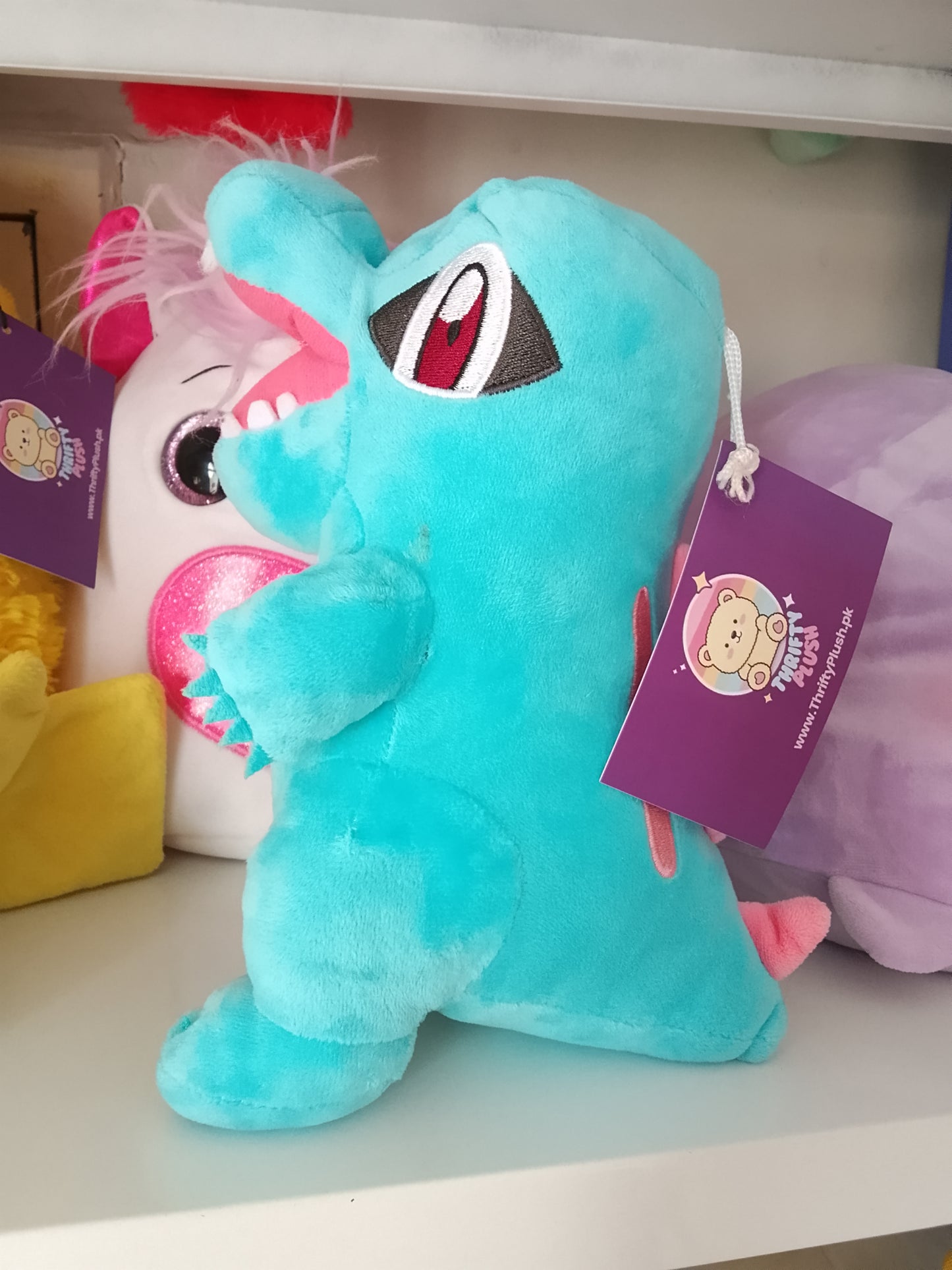 Totodile plush toy, a popular character from the Pokémon franchise.