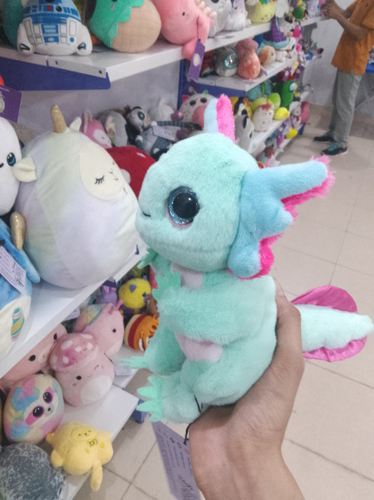 Ty Beanie Bellies Alex the Pastel Axolotl plush toy with glittery blue eyes.