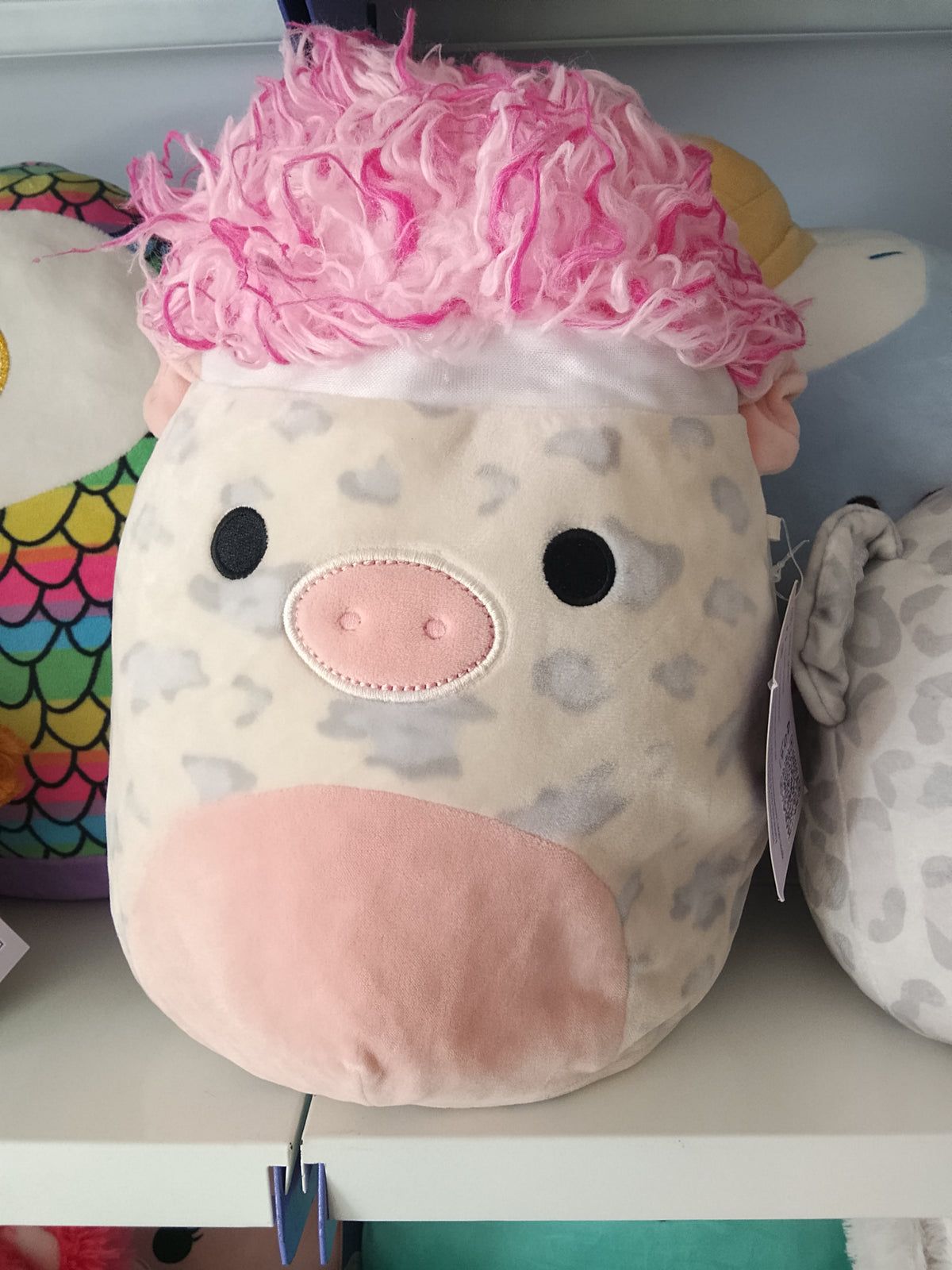 Squishmallows Squish-doos Rosie the Pig plush toy featuring a pink furry hairstyle.