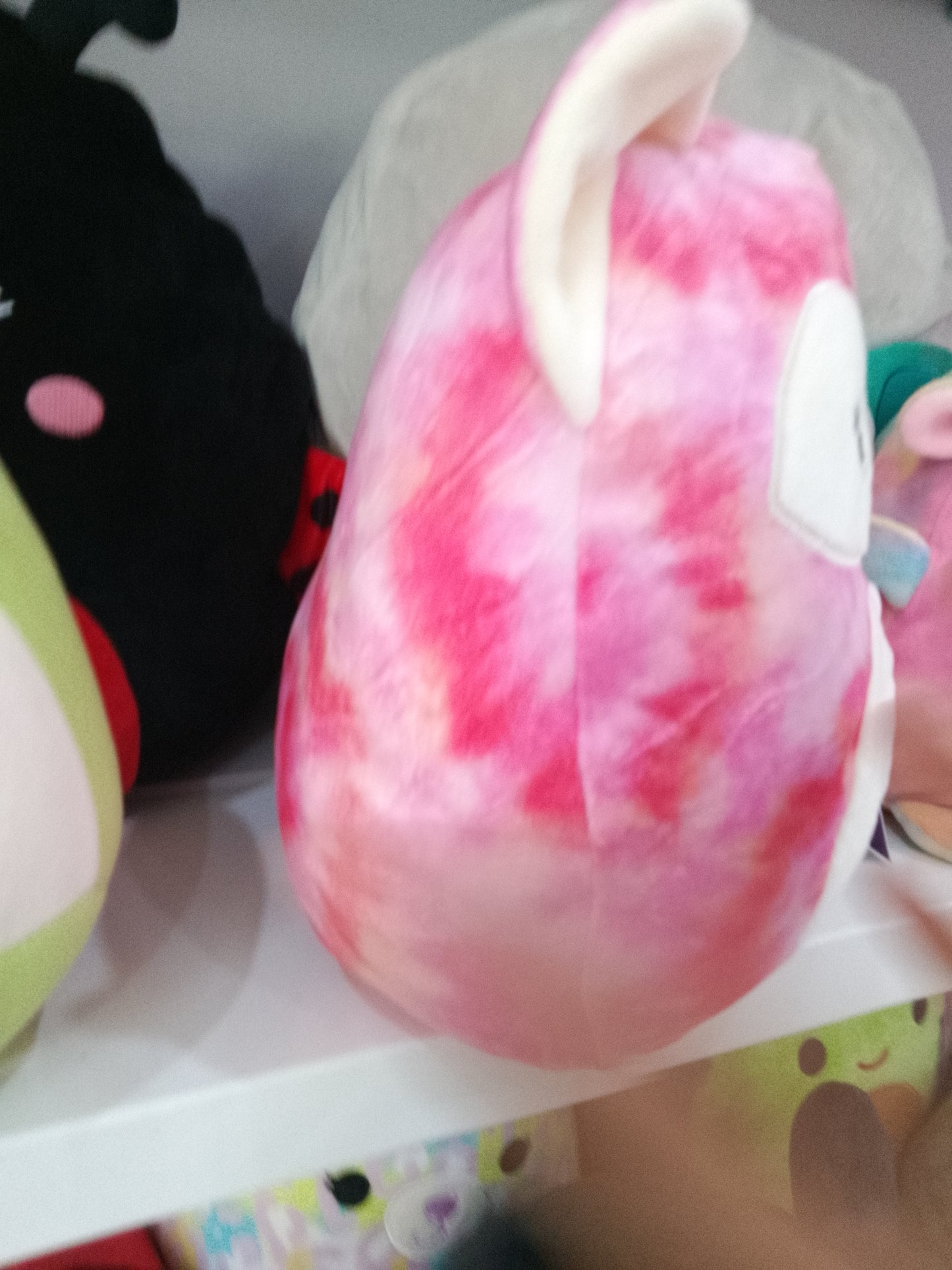 Squishmallow Kellytoy Sabine the Fox plush toy in a pink tie-dye pattern.