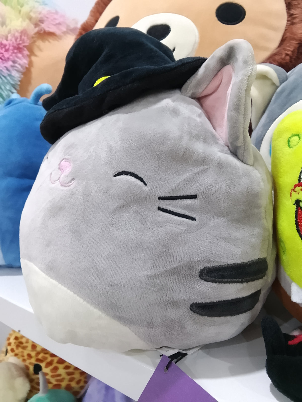 Halloween Squishmallows Flip-A-Mallow Tally the Cat plush toy.