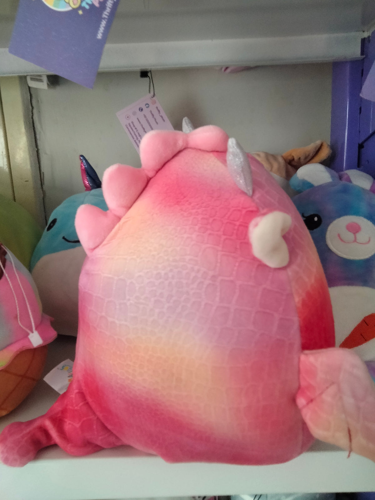 Squishmallows Celestina the Dragon plush toy.