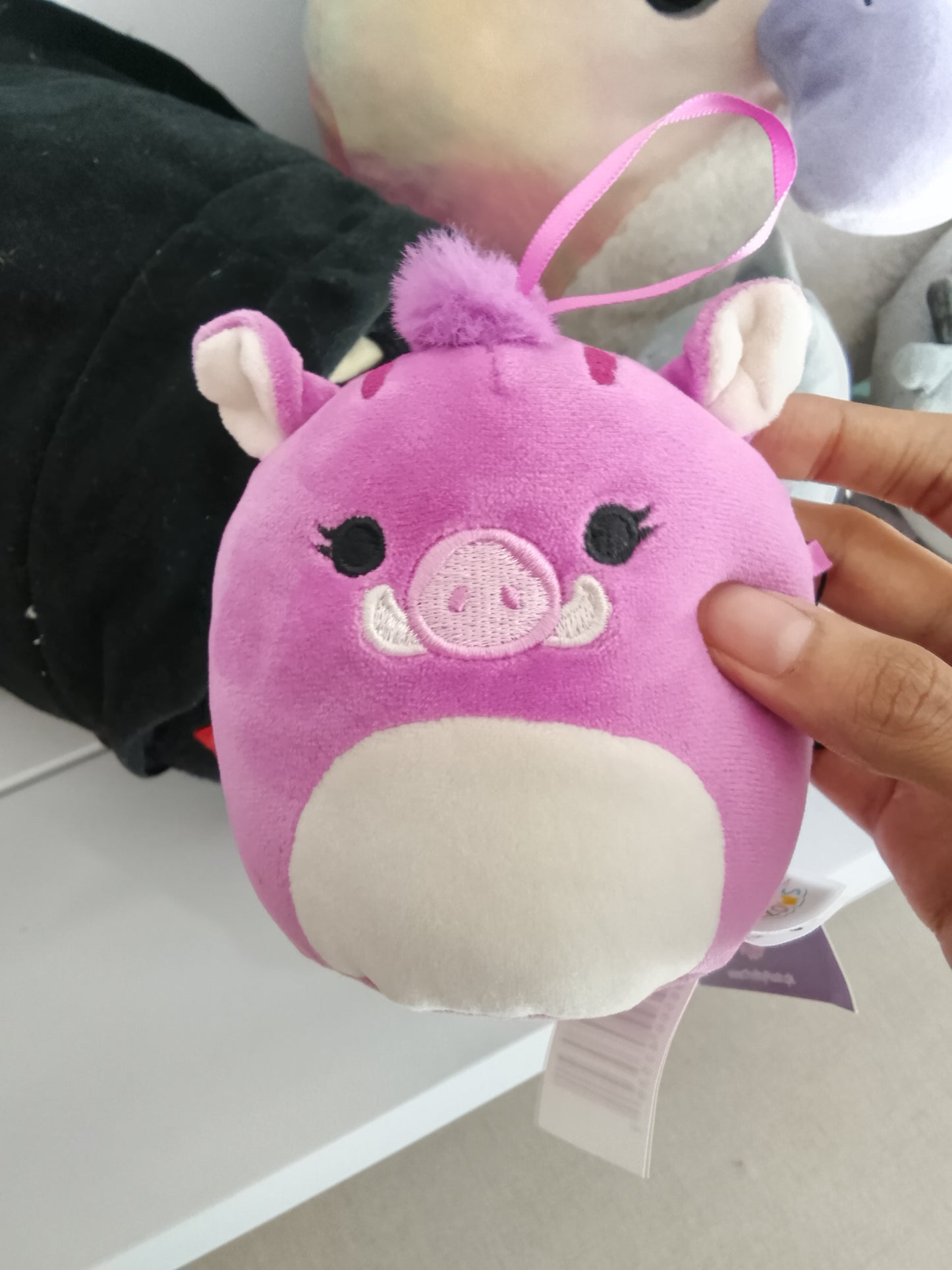 Jenna the Purple Boar from the Squishmallows brand.