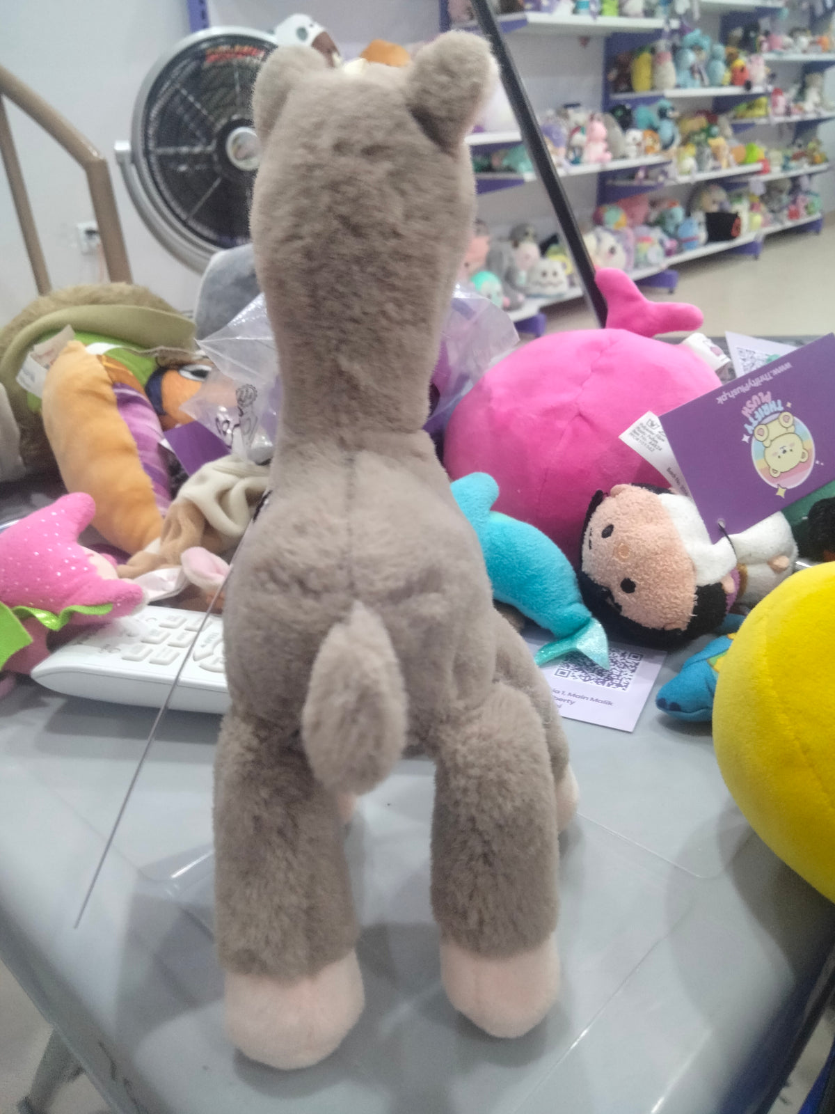 grey plush alpaca doll pendant with long legs.