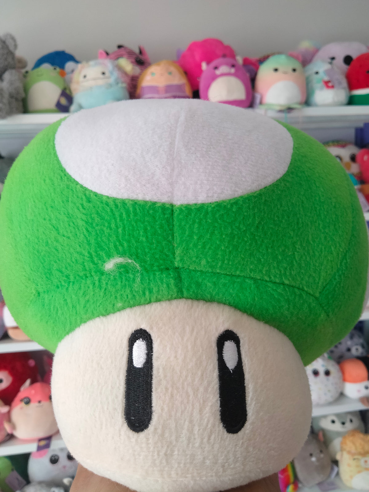Super Mario All Star Collection 1-Up Mushroom plush doll.