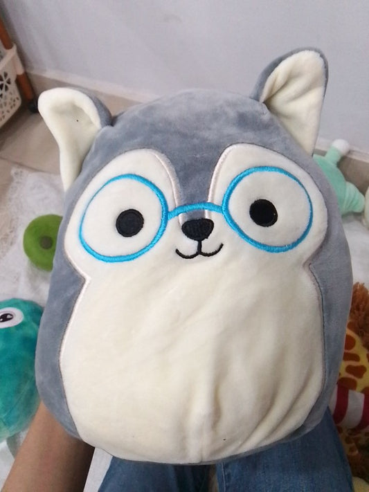 Squishmallows Ryan the Husky plush toy featuring blue glasses.