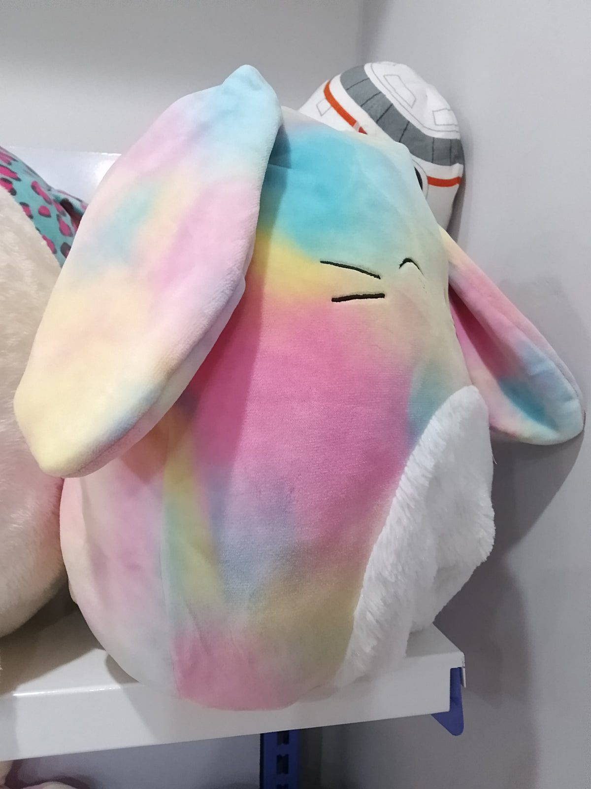 Squishmallows Candy the Rainbow Bunny plush toy.