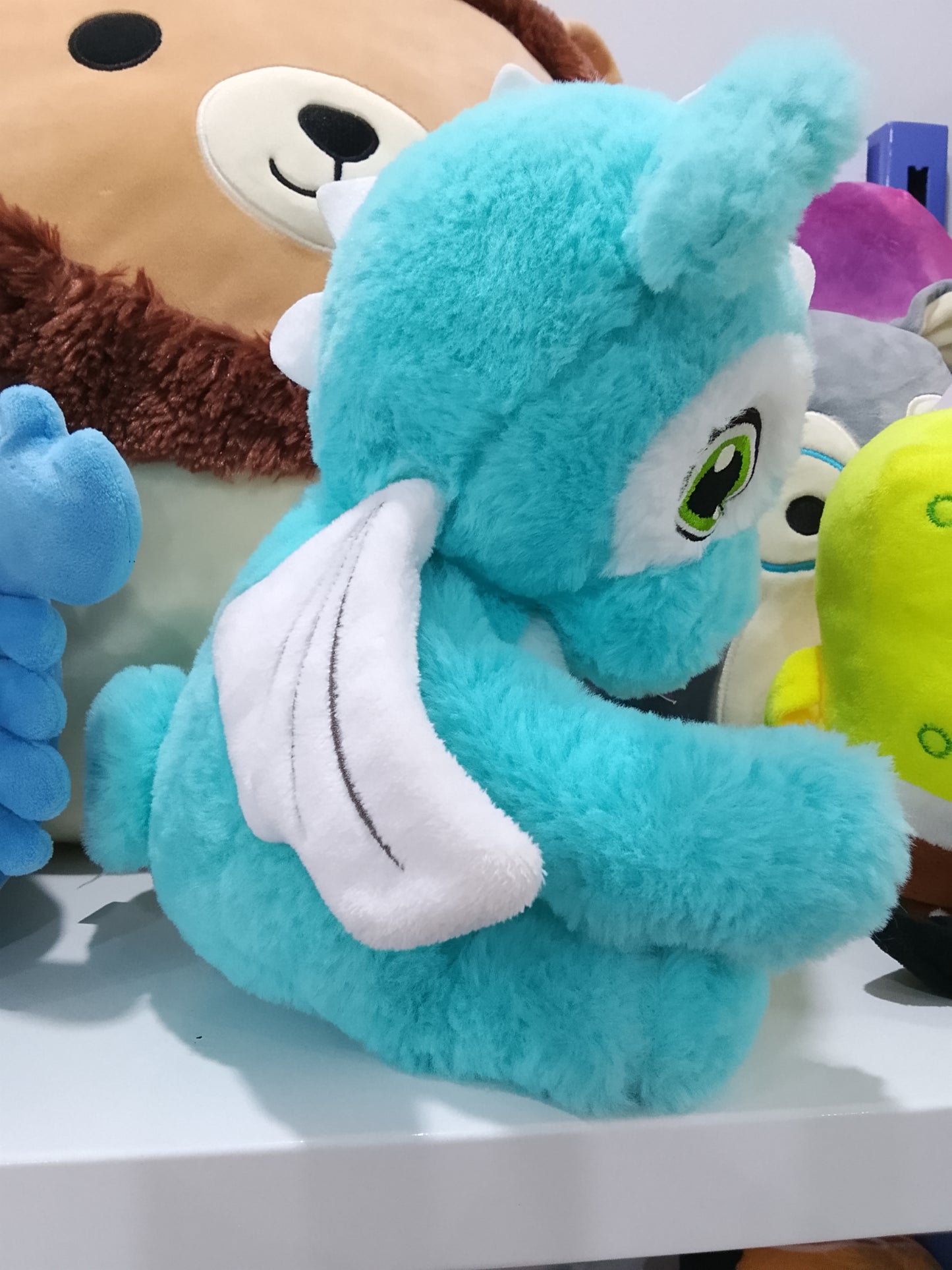 Blue dragon plush toy.