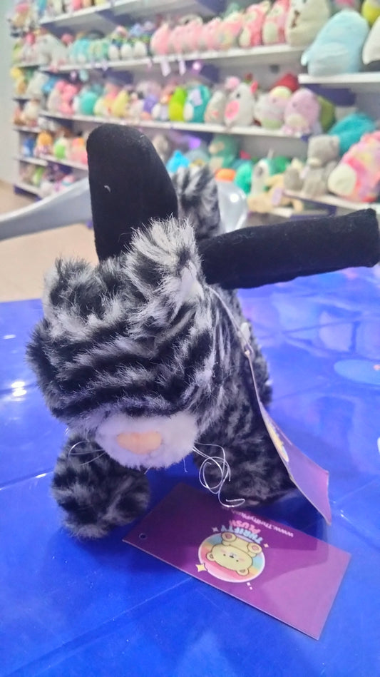 This is a grey and black striped plush cat toy