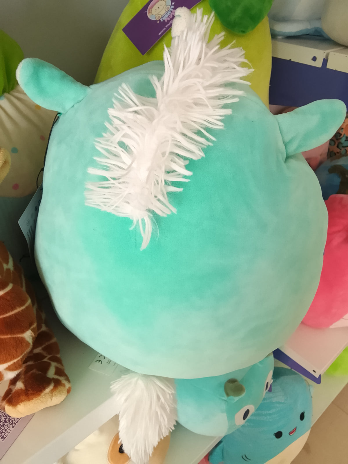 Squishmallows Kennedy the Unicorn Squish-Doos plush toy.