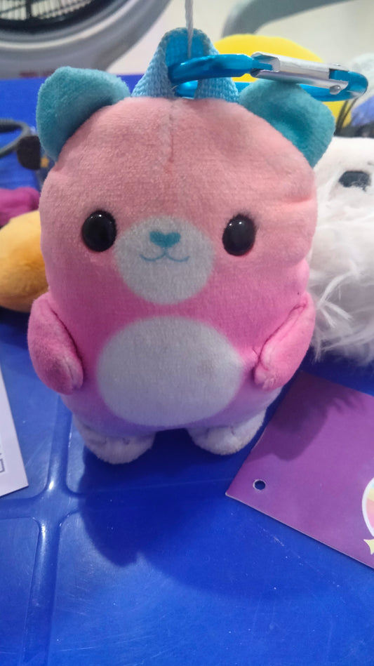 Zuru Real Littles Plushie Pet Backpack featuring a pink bear with blue ears.